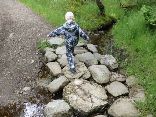 Boy on the stepping stones