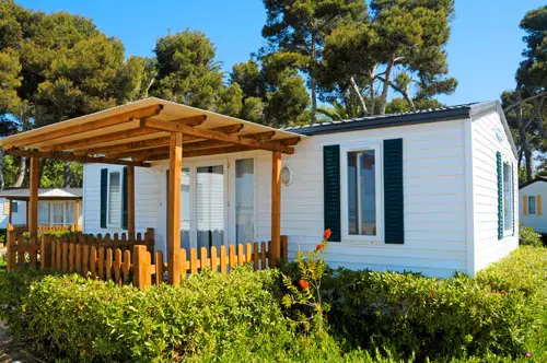 closeup of a mobile home in a campsite on the beach