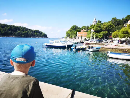 Boy looking over the water in Cavtat