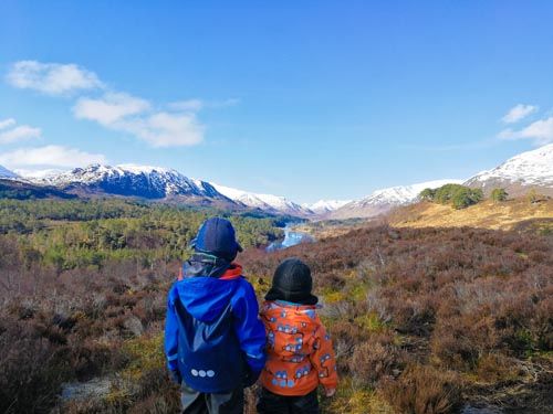 Brothers standing in front of Glen Affric