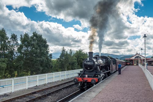 AVIEMORE, BADENOCH and STRATHSPEY/SCOTLAND - AUGUST 24 : Ivatt 46512 Locomotive at Aviemore Station Scotland on August 24, 2015. Unidentified men.