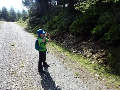 young hiker taking photos