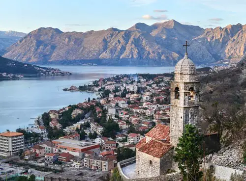 The view over Kotor, Montenegro, the old church, the bay and the mountains from the ancient fortress wall