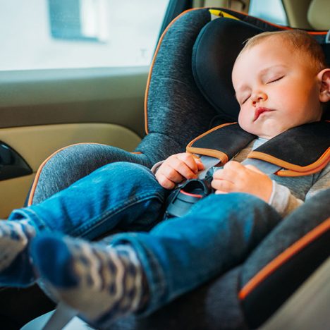 baby sleeping in a car seat