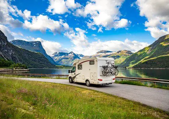 Family vacation travel RV, holiday trip in motorhome, Caravan car Vacation. Beautiful Nature Norway natural landscape.