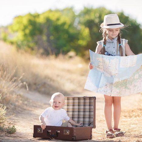 Travel in a suitcase with her older sister
