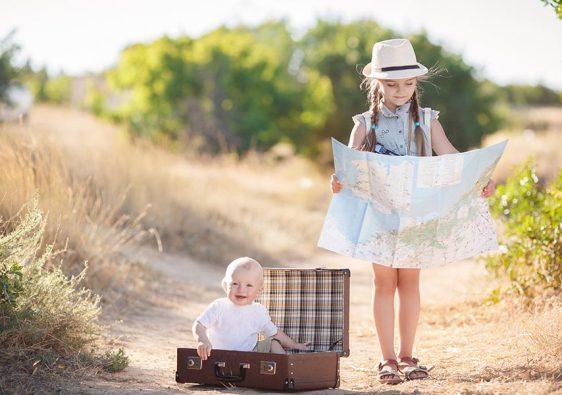 Travel in a suitcase with her older sister